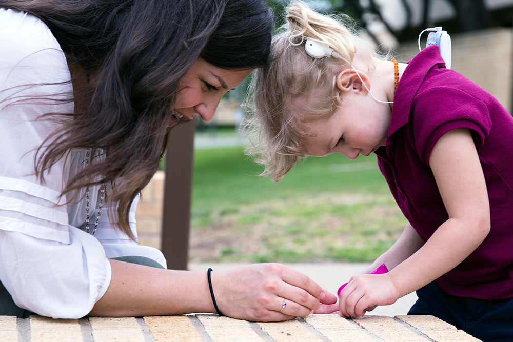 Student working with pre-audiology toddler