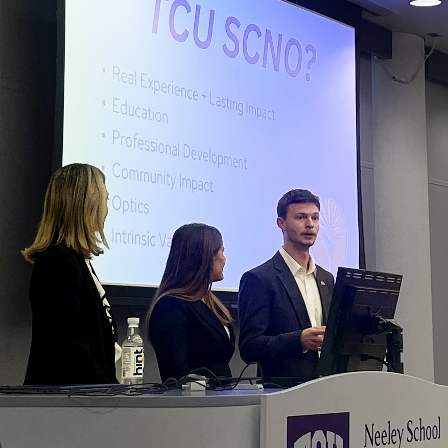 Photo of Ben Gregory, a junior business information systems major, presenting for his club SCNO