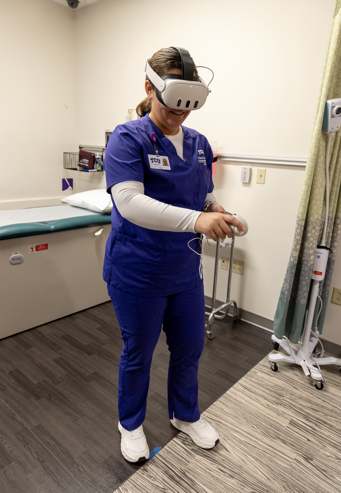 A TCU nursing student participating in the Health Assessment course, where students practice patient care in a VR setting.