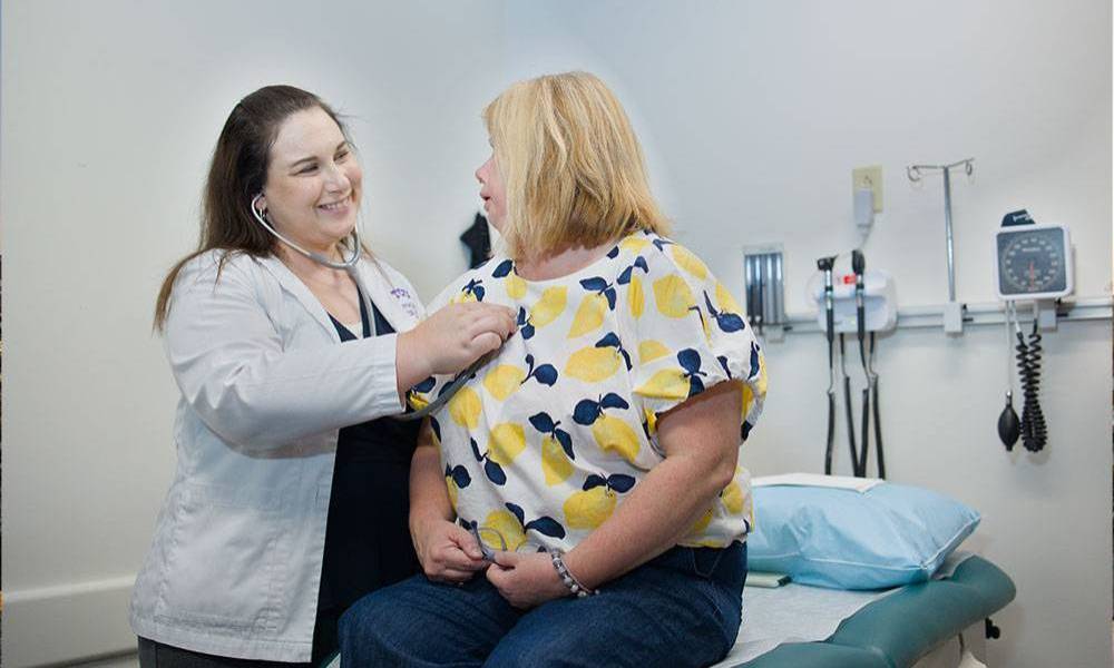 PA with patient in clinic