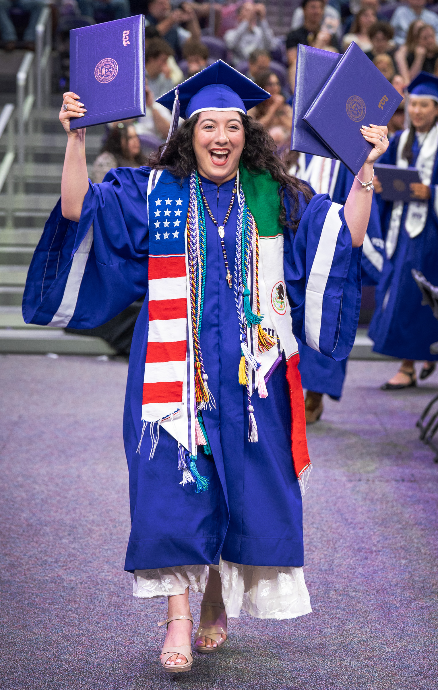Karina Jimenez Torres '26, walking with her three degrees earned simultaneously at TCU