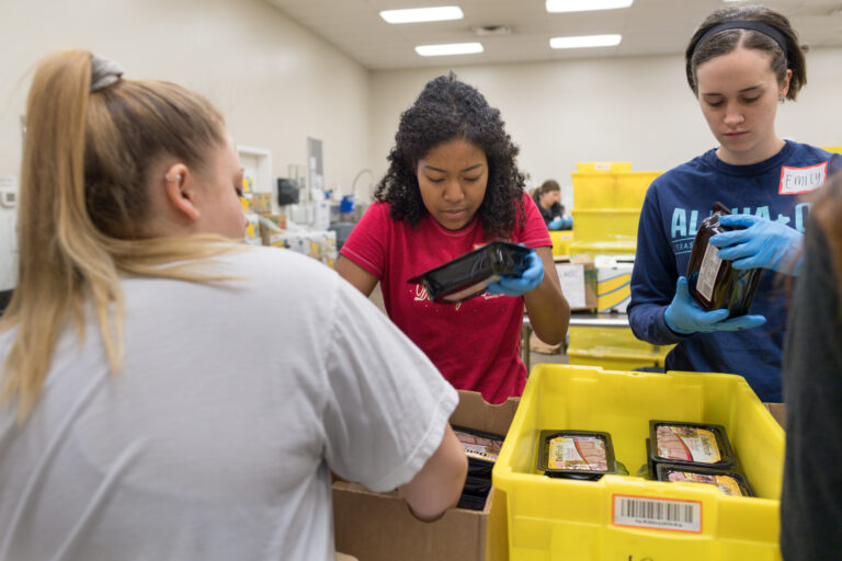 TCU students volunteering at a food pantry