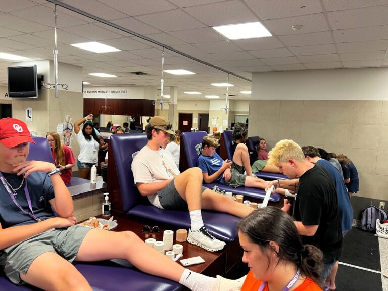 Athletic Training Workshop attendees learn taping procedures in the TCU athletic training facilities.