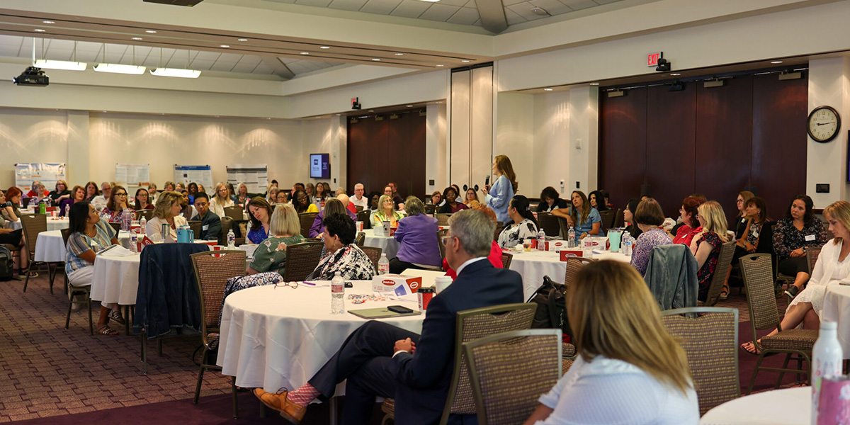 Texas Doctor of Nursing Practice Conference attendees listening to a speaker
