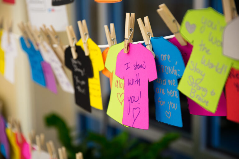 Words of encouragement are publicly displayed during a Take Back the Night event at TCU
