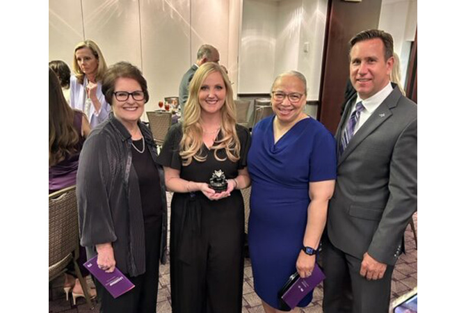 Marilyn Davies, Dr. Morgan “Joey” Davies, Paula Rhodes Parker, and Marilyn and Morgan Davies, Dean of Harris College of Nursing & Health Sciences Dr. Chris Watts posing for a photo after the university-wide Leadership Awards dinner