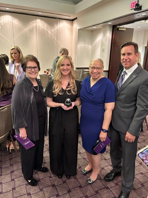 Marilyn Davies, Dr. Morgan “Joey” Davies, Paula Rhodes Parker (BSN ’77) and Marilyn and Morgan Davies Dean of Harris College of Nursing & Health Sciences Dr. Chris Watts posing for a photo after the university-wide Leadership Awards dinner
