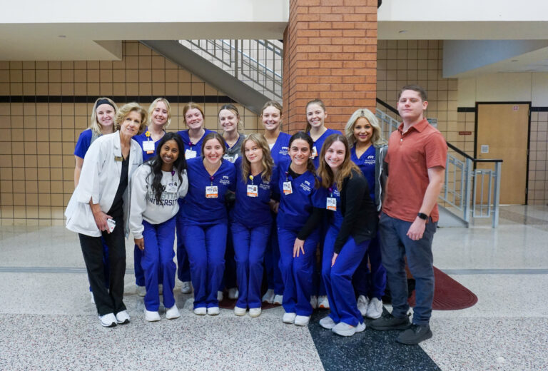 TCU Nursing students pose with Assistant Professor Sharon Canclini and North Texas Harm Reduction Alliance Founder Phillip Tashash