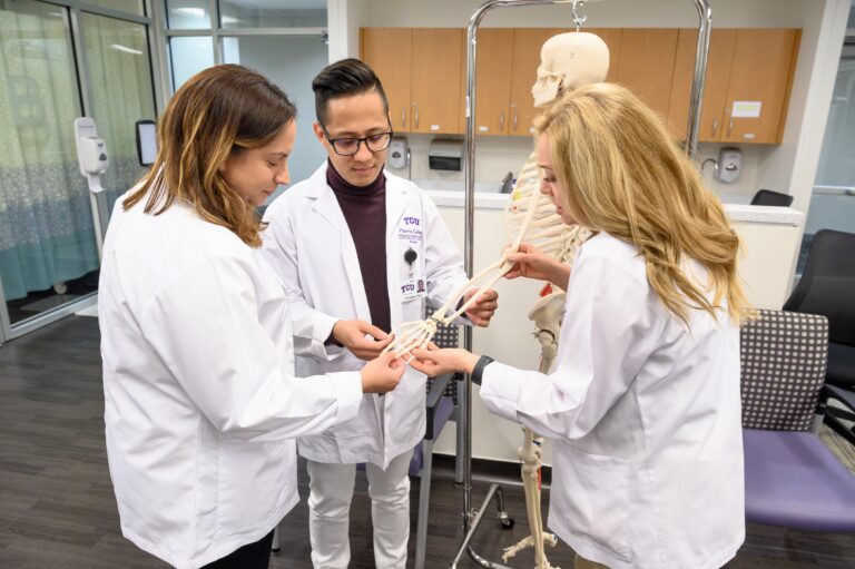 Graduate students in the TCU nursing program receive instruction in skeletal anatomy. 