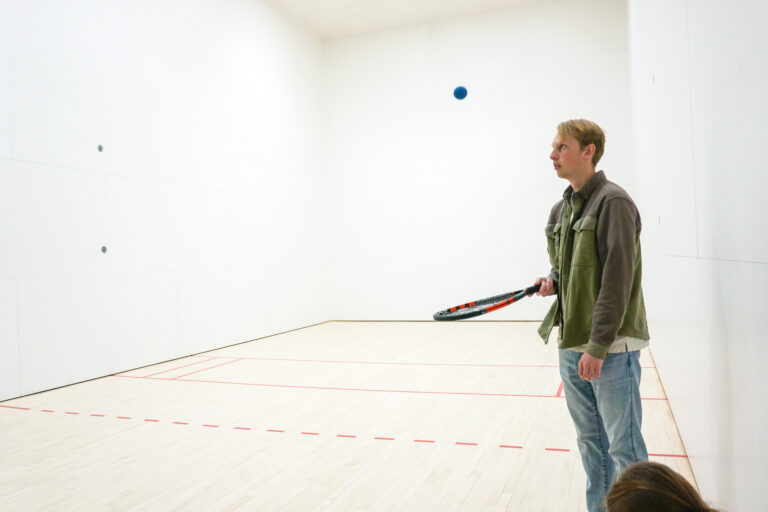 Student inside the racquetball court