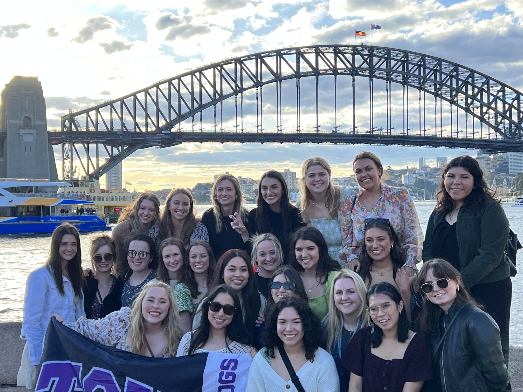 TCU students posing in front of the Sydney Harbour Bridge