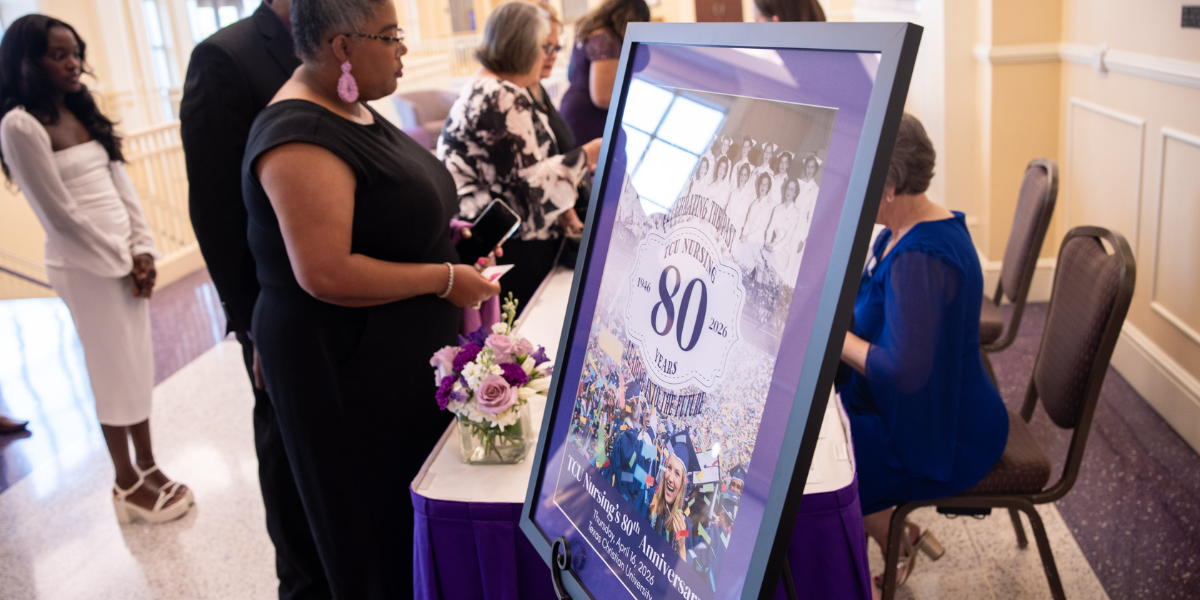 Welcoming, check-in table at the 80th celebration of nursing at TCU.