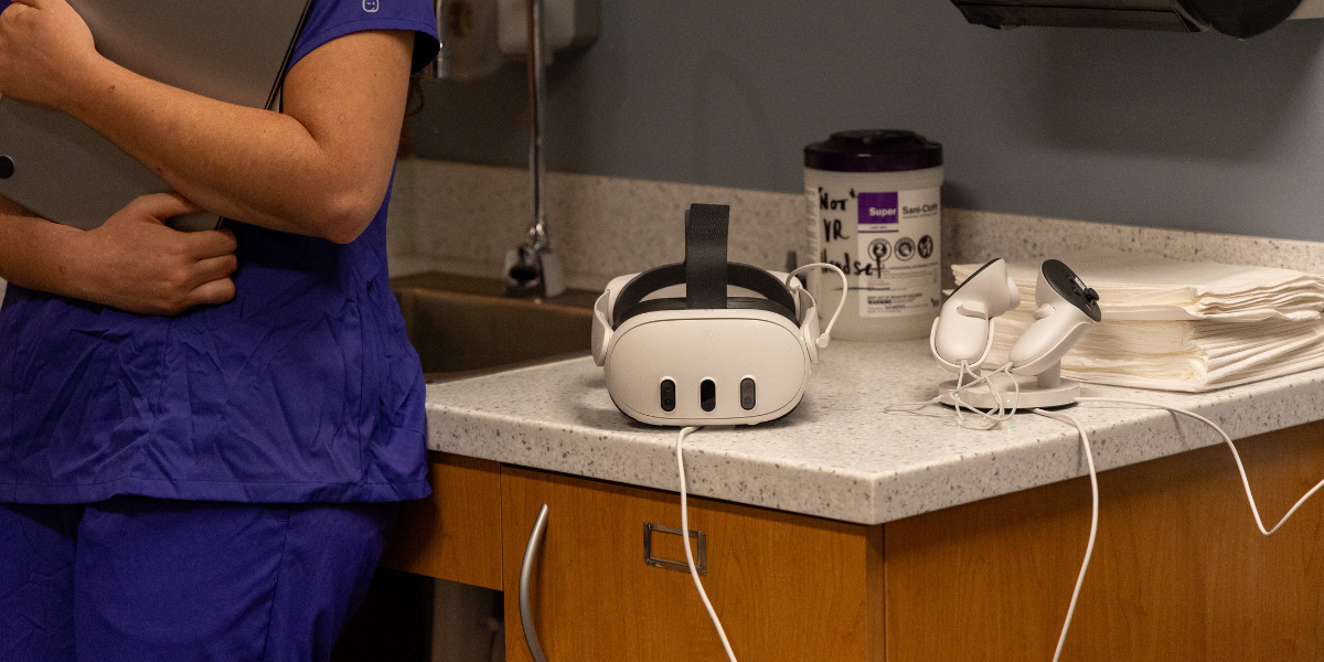 A close up image of the VR headset and handheld devices that TCU nursing students use in their Health Assessment course